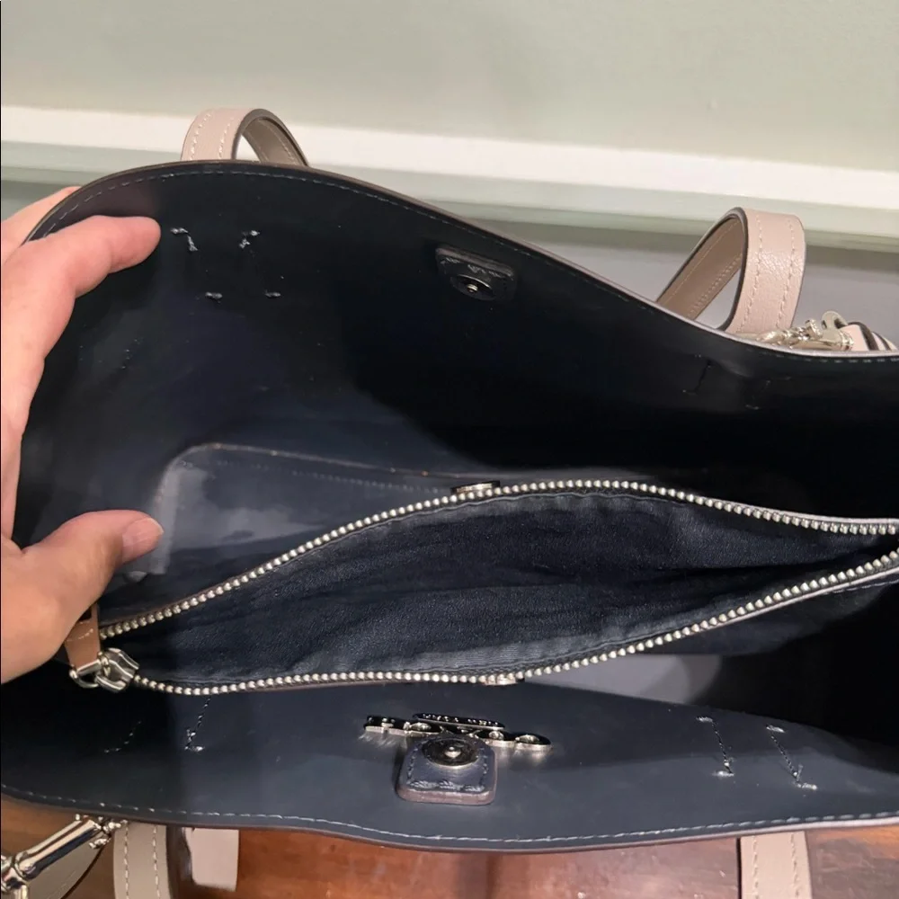 Large Coach handbag.  Purple/ grey color